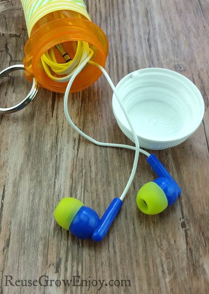 ear buds stored in pill bottle