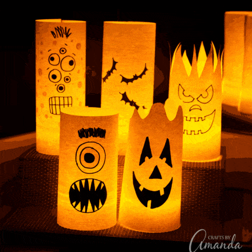 By day they are colorful shelf or window decorations, but by night they are paper Halloween luminaries!