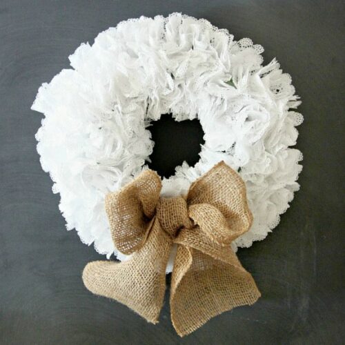 Learn how to make a simple doily wreath. Customize this paper wreath with different bows or decorations, and watch your wreath last all year long. #doilycraft #doilies #easycrafts #diywreath #wreath #adultcrafts #homedecor #diyhomedecor #doily #craftsforseniors