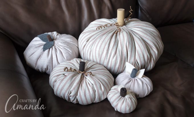 a bunch of fabric pumpkins