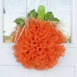 Make this wonderful deco mesh pumpkin wreath to hang on your door this fall!