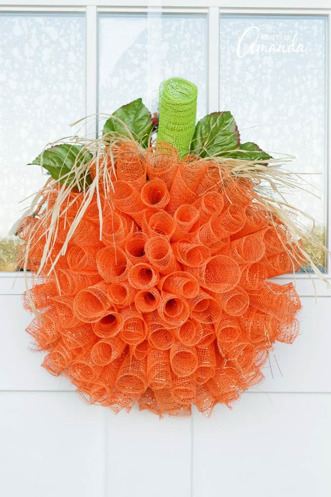 Deco mesh pumpkin wreath on door