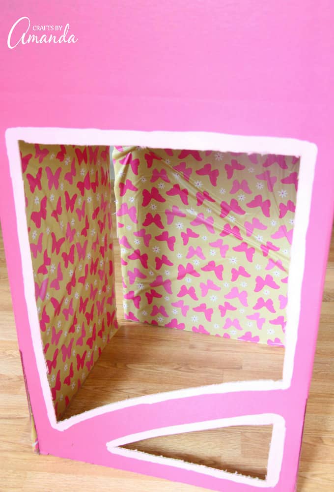 pink painted box with wrapping paper inside