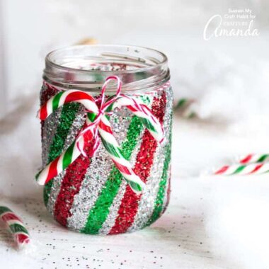 This colorful, glittery candy cane Mason jar luminary is a festive way to add some twinkling warmth to your Christmas decorating.