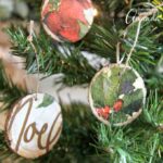 These decoupage wood slice ornaments are an easy way to make your own tree ornaments. Use paper napkins in any pattern or color to make custom ornaments.
