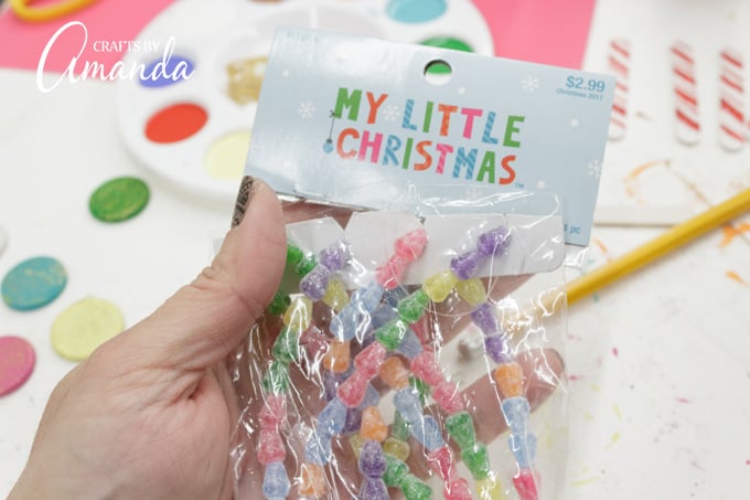 Miniature Christmas tree decorations are great for making a birdhouse gingerbread house.