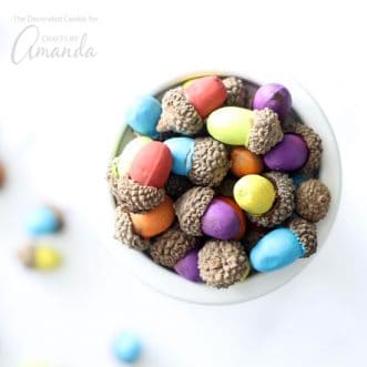 These painted acorns are an easy seasonal craft. Gathered in little bowls or spread on your table these acorns make a colorful Thanksgiving centerpiece!