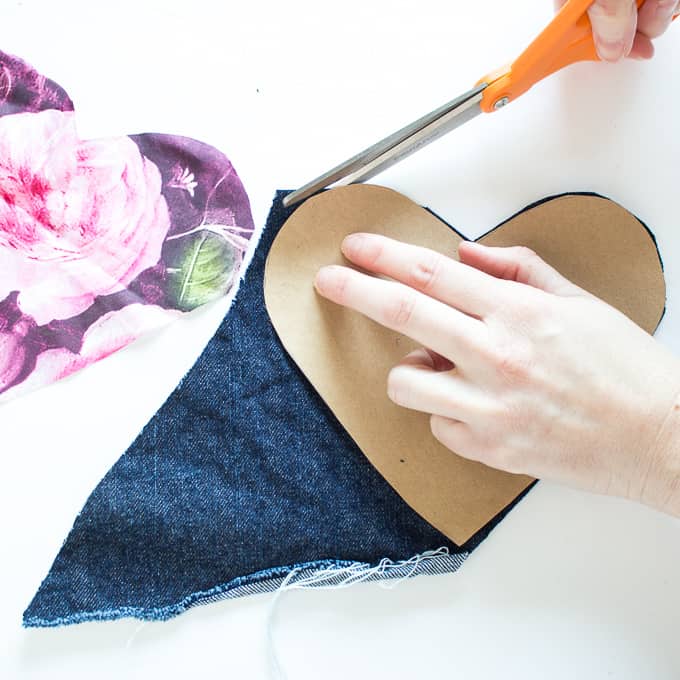 cutting heart out of scrap denim