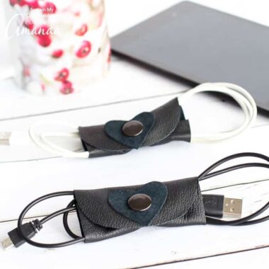 Get your rampant collection of unruly cords organized with these useful and simple DIY leather cord organizers for electronics. With a little heart embellishment, these make a great DIY Valentine's Day gift for him or her!
