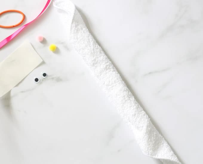 rolled white washcloth