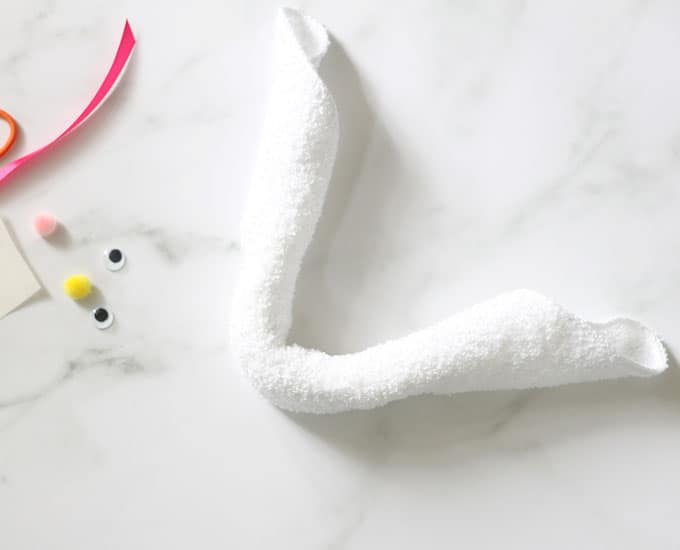 bent and rolled white washcloth