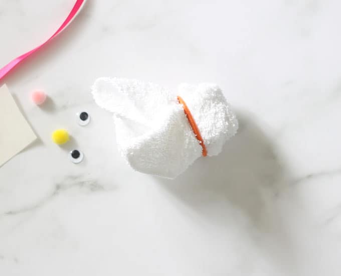 white washcloth tied with a ribbon