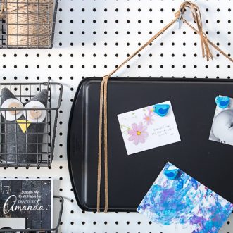 We'll show you how to re-purpose an old and no longer usable cookie sheet into a practical and stylish new magnetic board for your kitchen, office space or craft room.