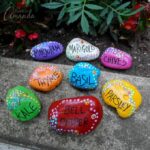 These beautiful rock garden markers have been painted with special outdoor paint. They look beautiful in the garden - get the instructions to make your own!