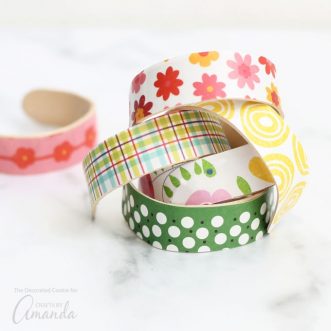 You can personalize these popsicle stick bracelets with any paper design you like, or make this a kid-friendly project, and let kids decorate the shaped bracelets with paint.