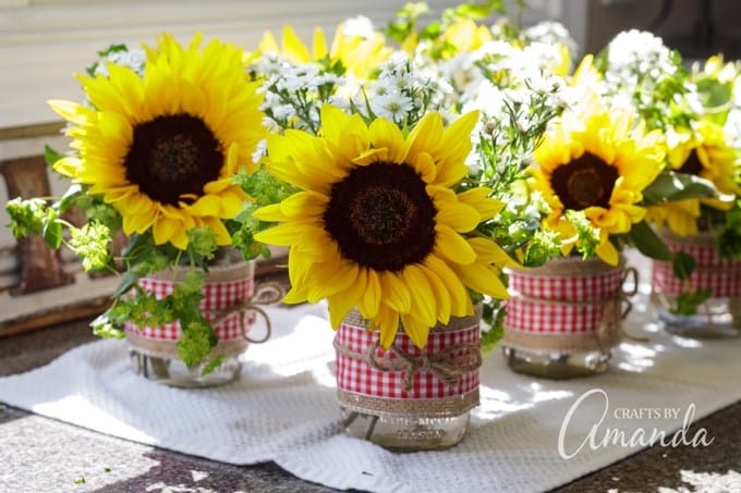 fresh sunflowers in barbecue themed jar centerpieces for bridal shower