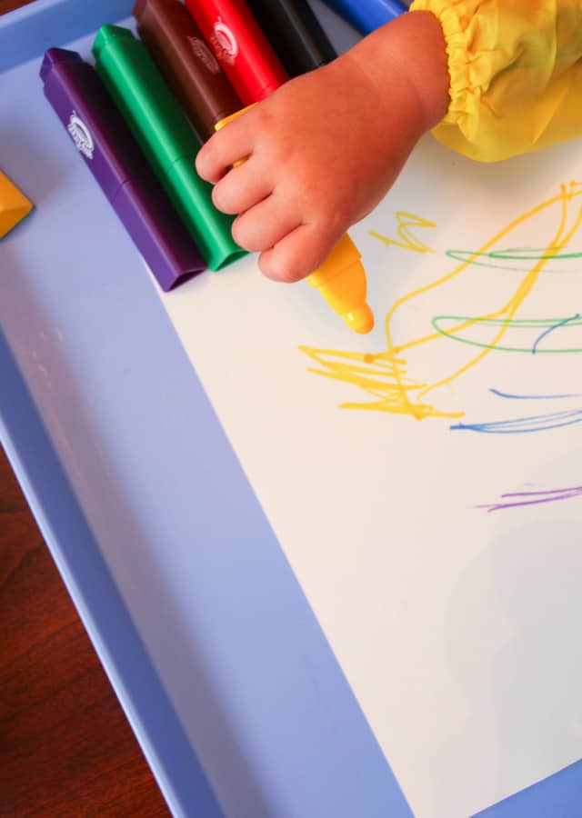 toddler hand holding marker