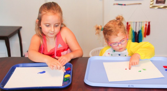 children finger painting