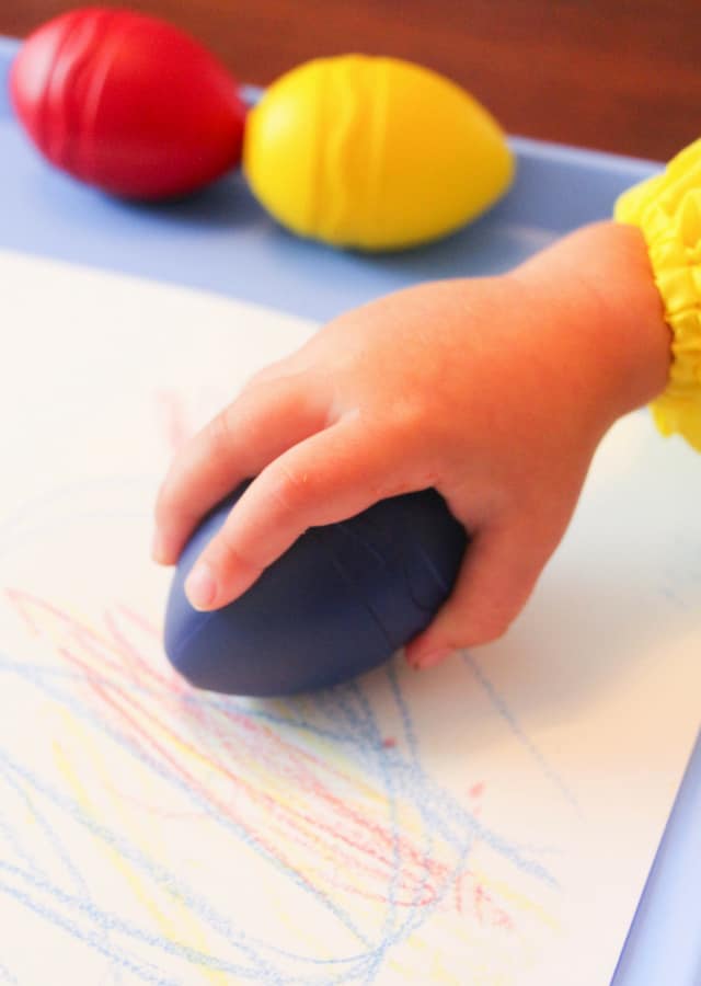 toddler using large crayon