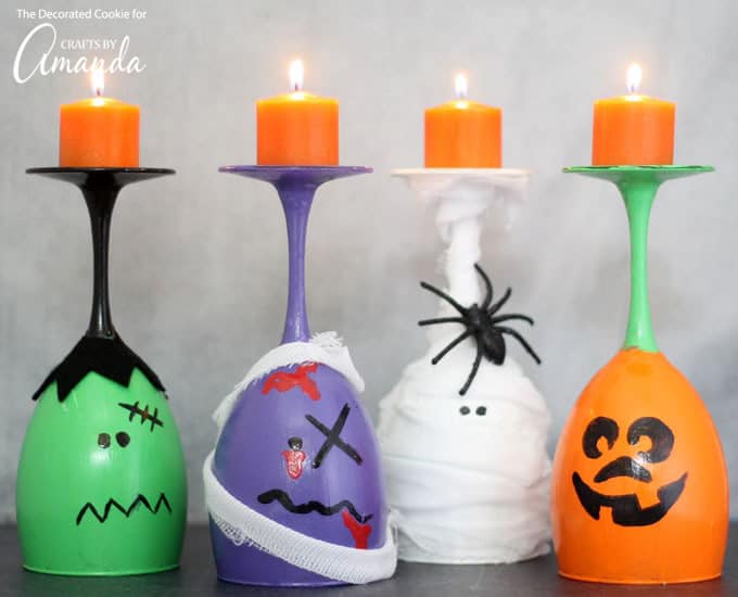 Halloween Wine Glass Candles painted like a zombie, Frankenstein, a mummy and a pumpkin.