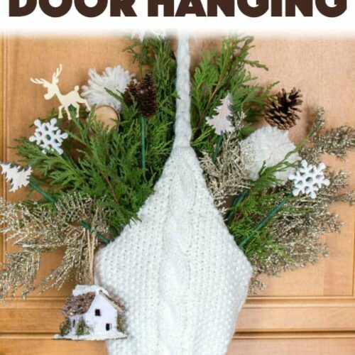 Create your own beautiful door hanging using some foraged greens, a knitted hat and some additional Winter-themed decor picks. #winter #wintercrafts #diy #christmasdecor #christmascrafts #adultcrafts #homedecor #diyhomedecor #easycrafts #hotglue