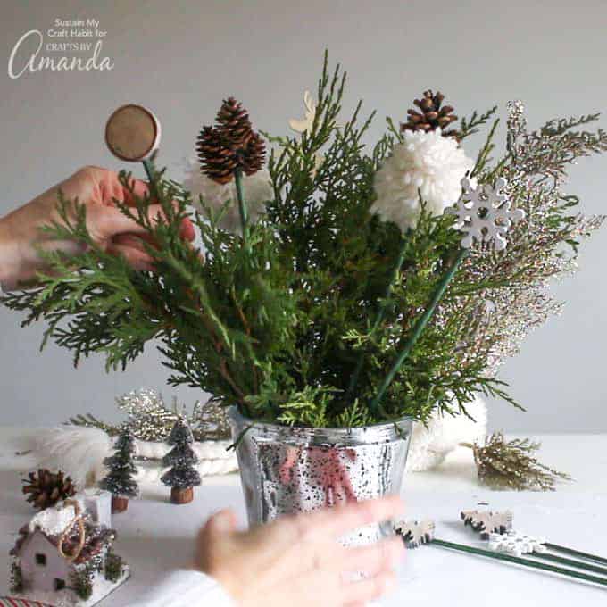 Add decorative picks and all greenery until full