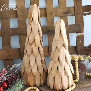 You can make these easy yet charming rustic feeling wood slice trees for your Christmas mantle or as a centerpiece on a table!
