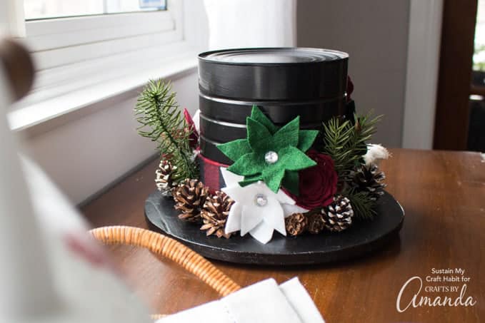 snowman hat centerpiece made from felt flowers and a coffee tin can.