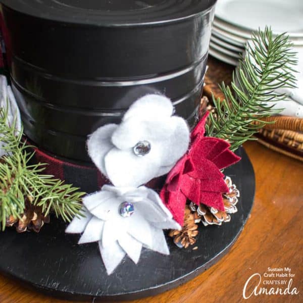 Snowman hat centerpiece with felt flowers and greenery