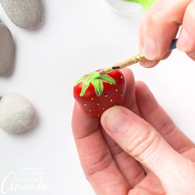 painting leaf onto strawberry rock