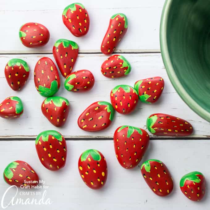 Strawberry Painted Rocks a fun outdoor craft for summer