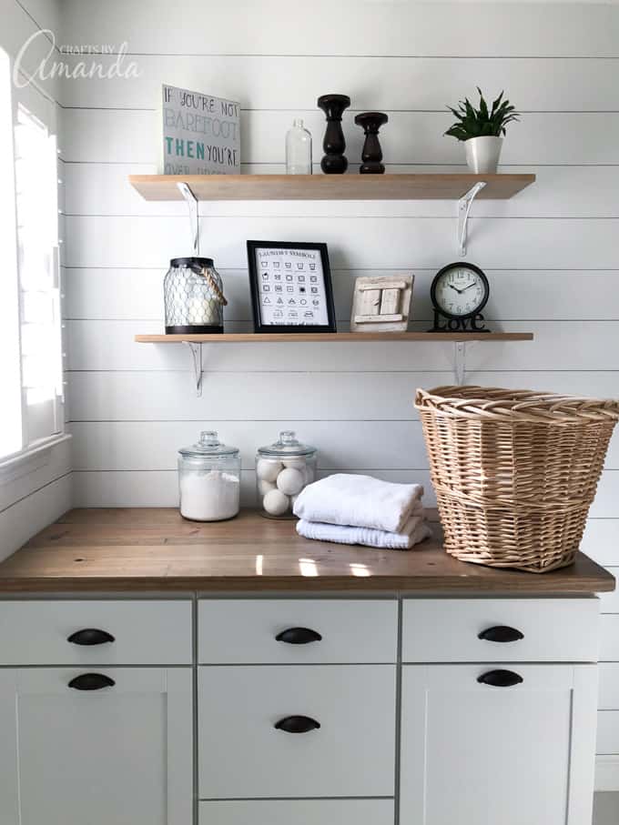 Laundry symbols printable framed on shelf in laundry room