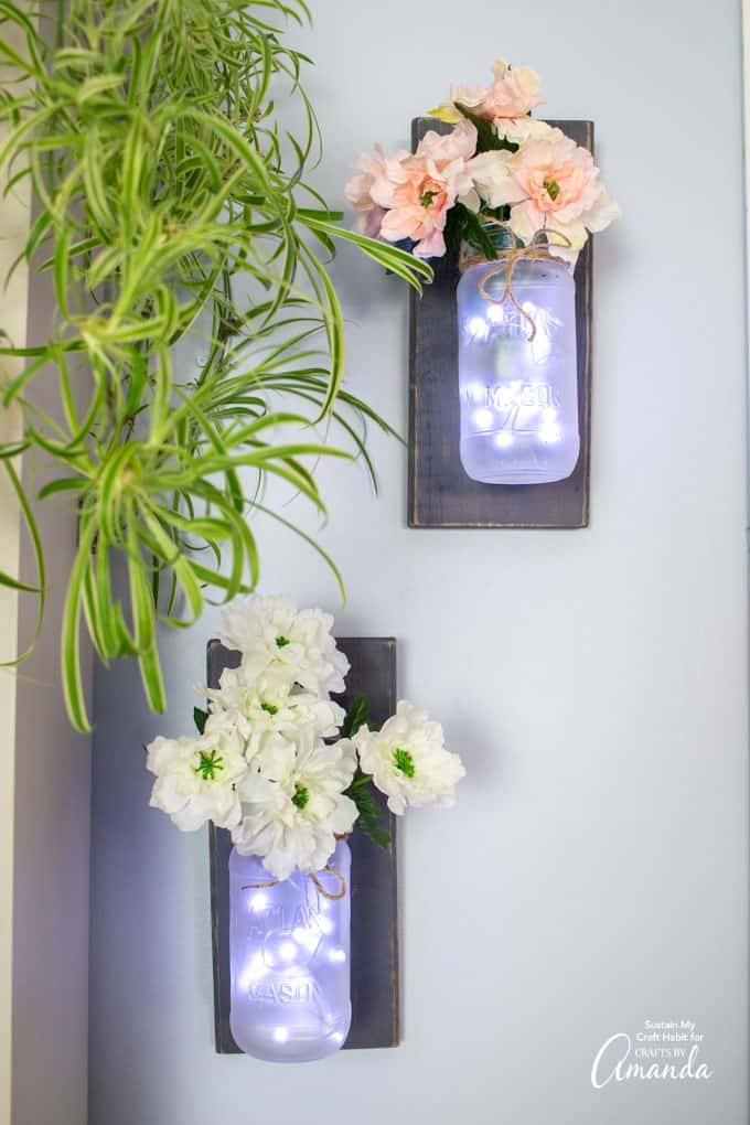 Mason Jar Wall Sconces with faux flowers and fairy lights