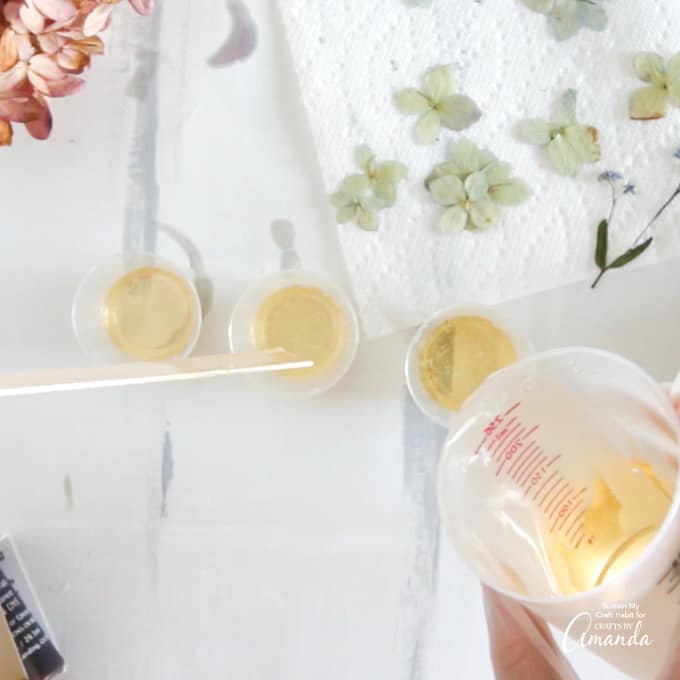 resin pouring into small cups