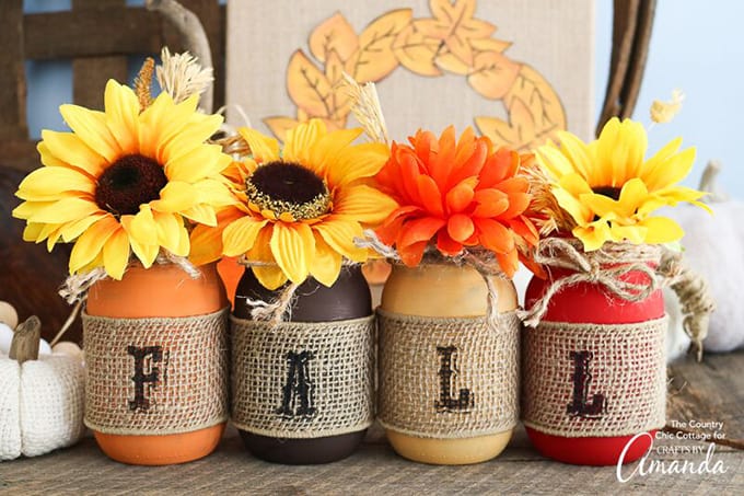 painted mason jars in fall colors with burlap