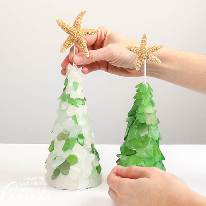 topping the seaglass Christmas tree with a starfish