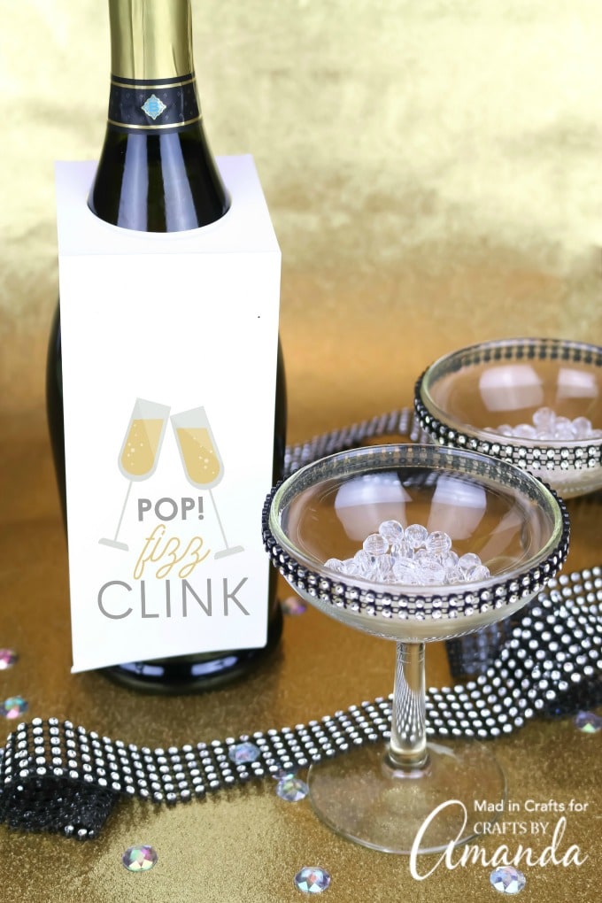 martini glasses and champagne bottle with new year bottle tag