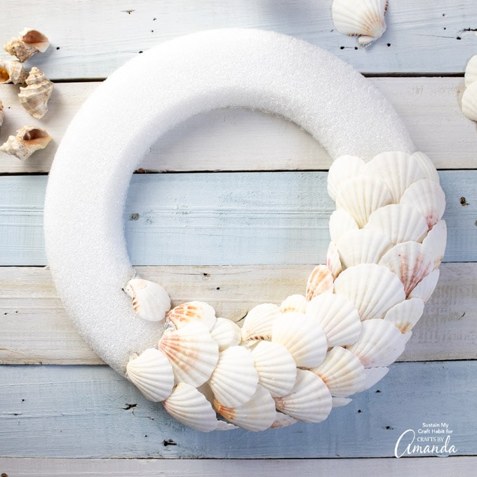 adding seashells to wreath form