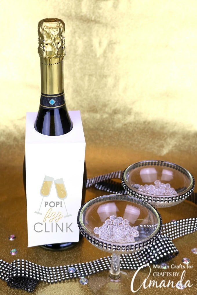 bottle of champagne with POP Fizz and Clink bottle tag