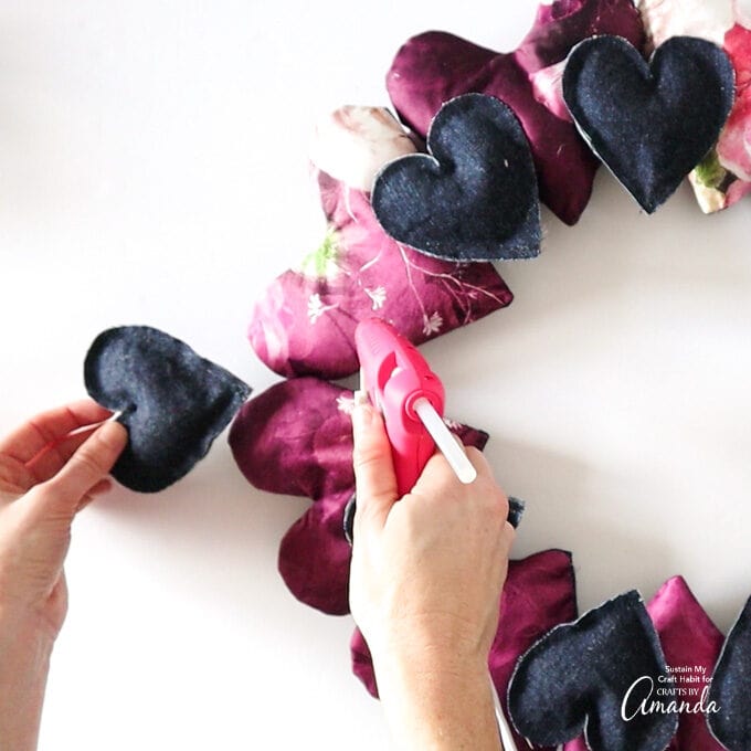 attaching small hearts to wreath