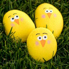 painted rocks - yellow chicks in grass