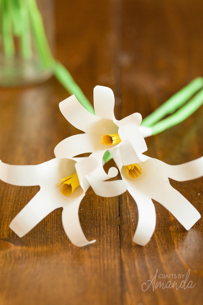 3 handprint easter lily flowers on table