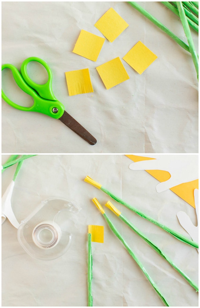 adding yellow paper on ends of green paper stems