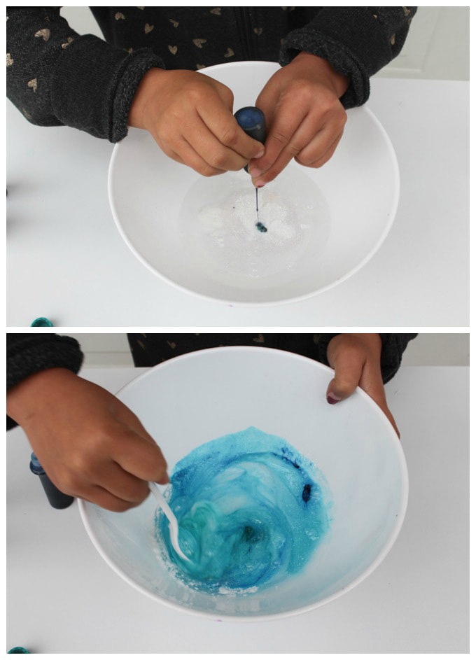 adding food coloring to bowl