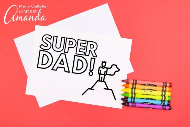 super dad coloring card with crayons on red background
