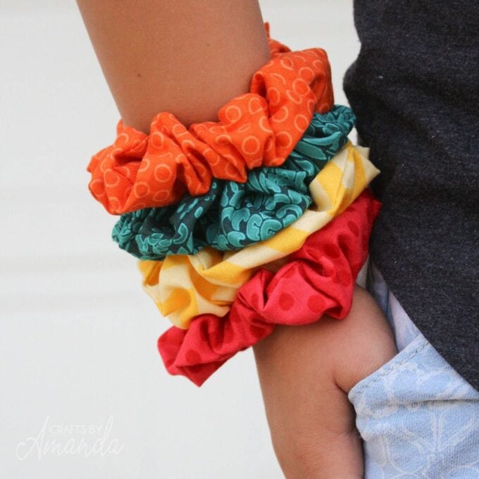 colorful DIY scrunchies on a girl's wrist