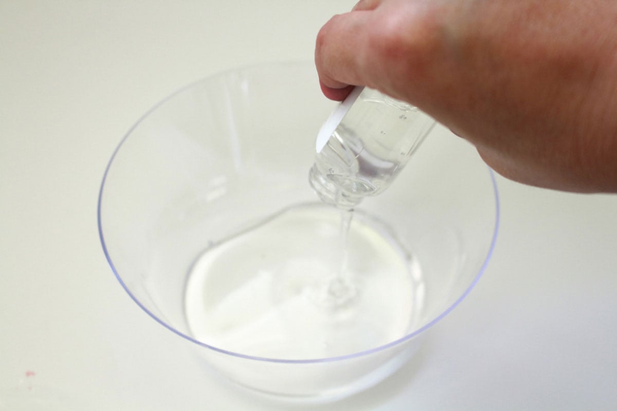putting clear glue in a bowl