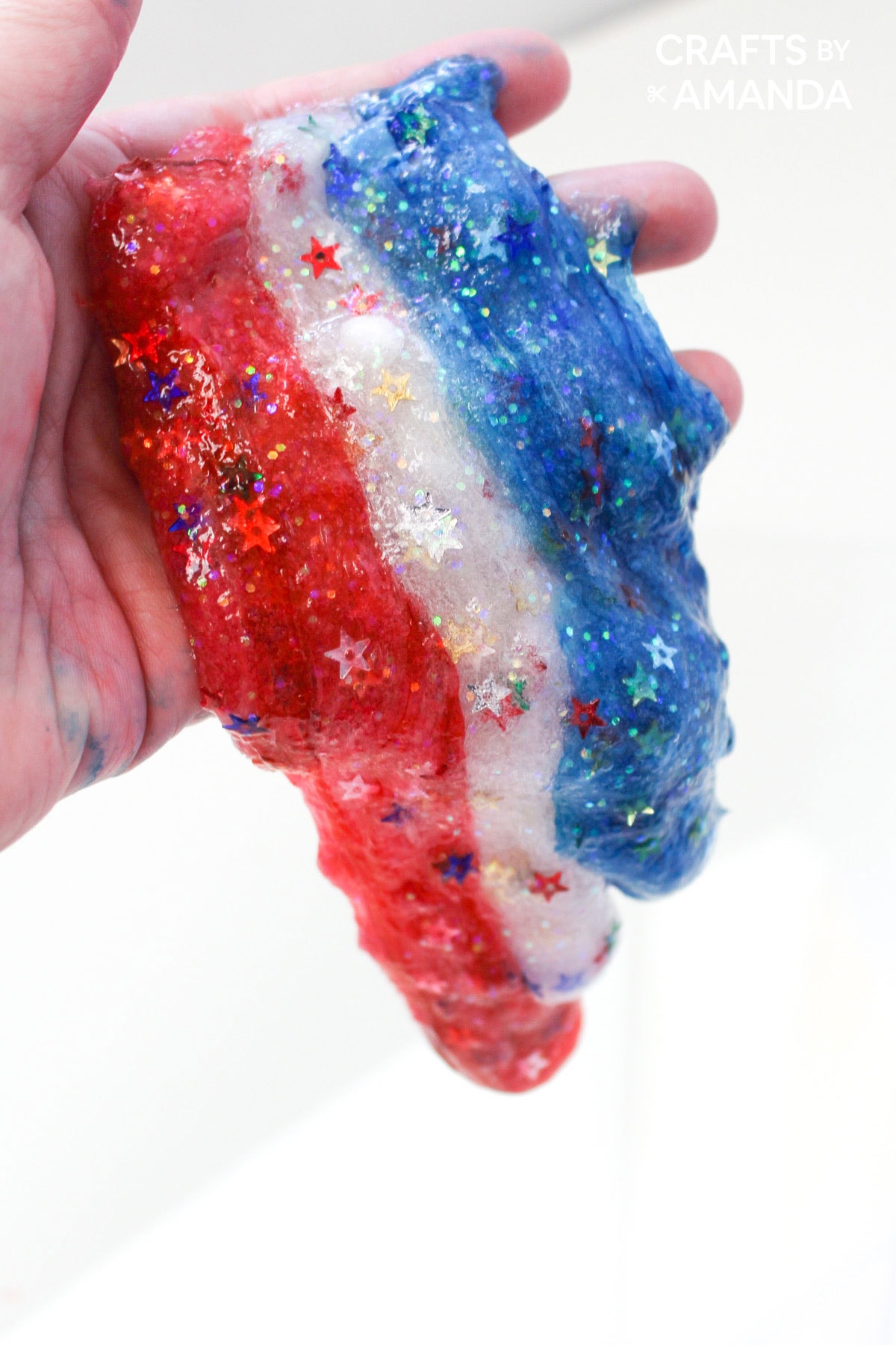 hand holding patriotic slime