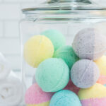 glass jar filled with colorful bath bombs