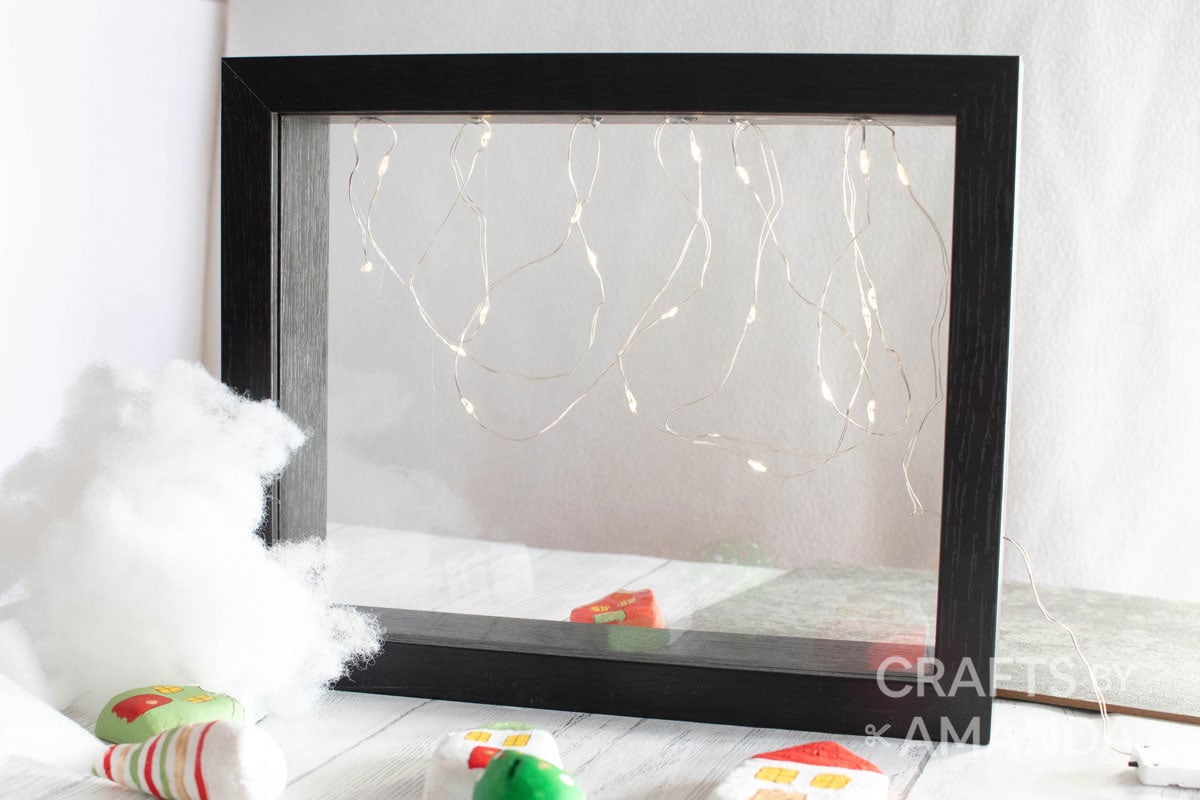 lights hanging from inside shadowbox